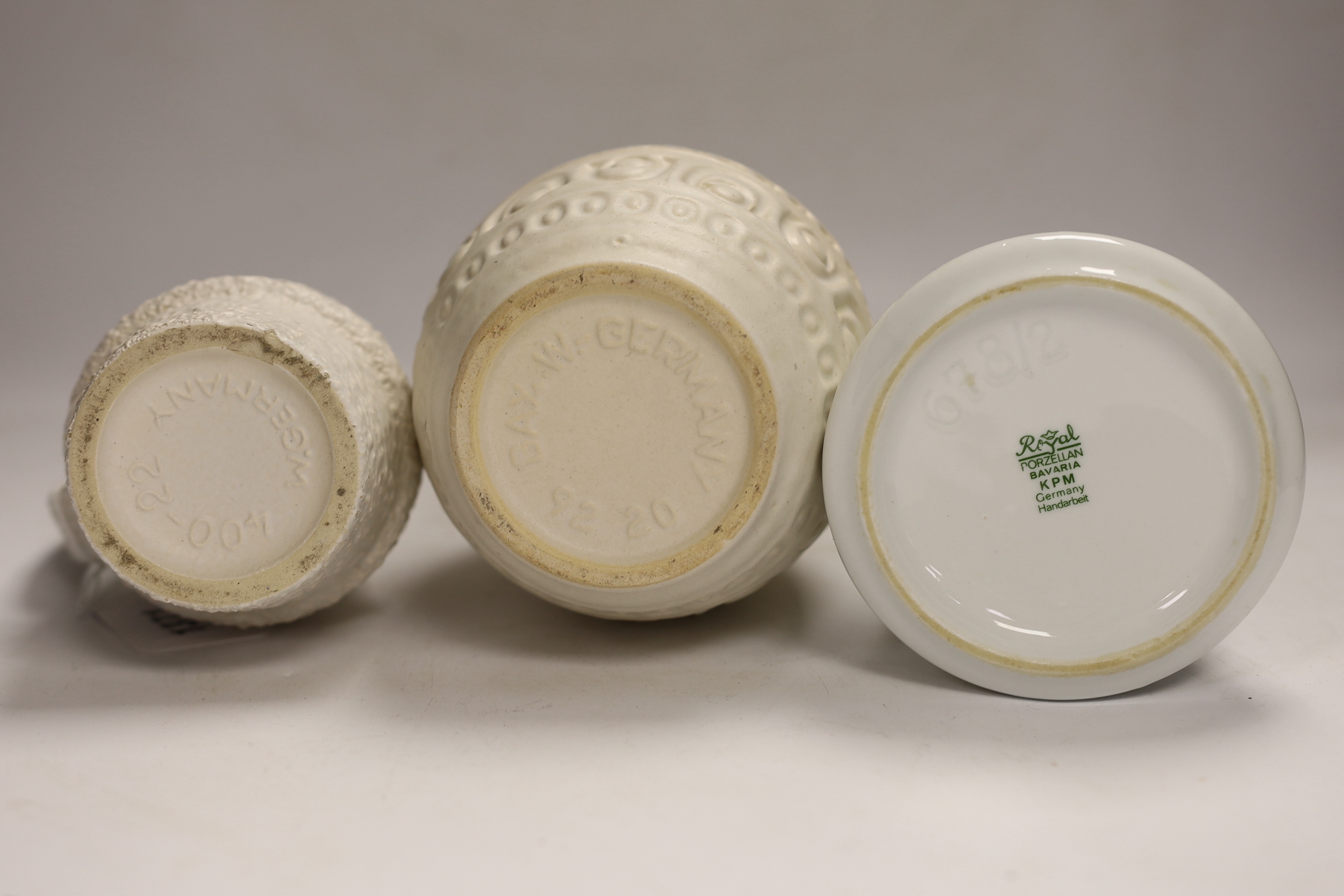 Five West German pottery and biscuit porcelain vases, tallest 24cm